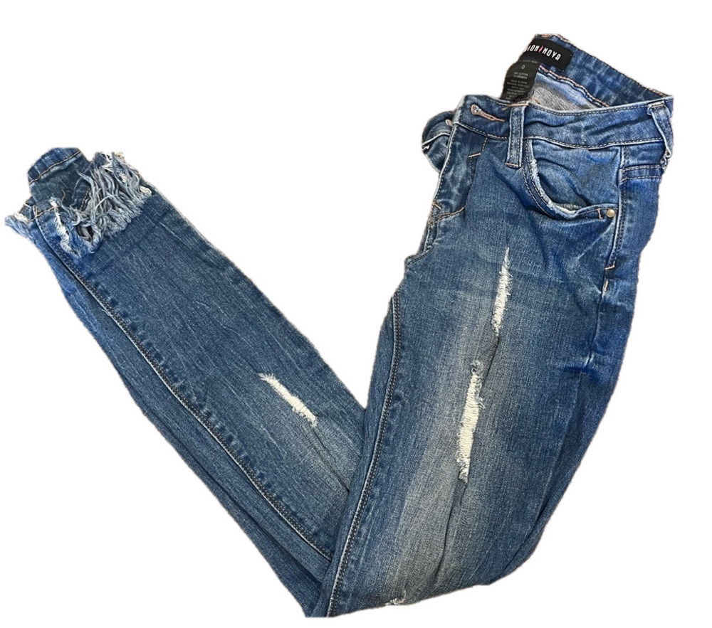 SKINNY LIGHT BLUE FASHION NOVA JEANS WITH RIPS AND FRAYED BOTTOMS